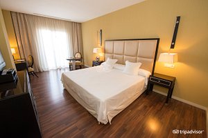 525 Hotel in Los Alcazares, image may contain: Flooring, Furniture, Bedroom, Bed