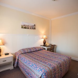 The Grant Hotel in San Francisco, image may contain: Furniture, Bed, Lamp, Bedroom