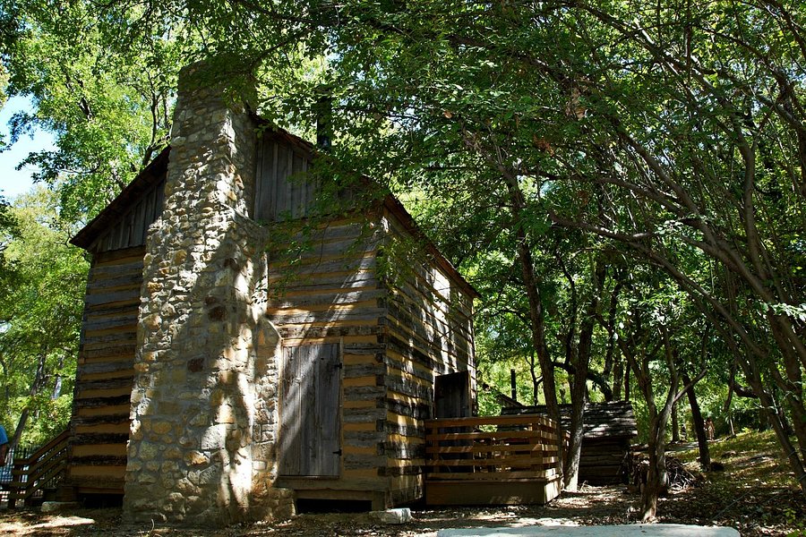 log cabin village tours