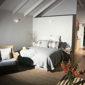 King-size bed - wool underlay, crisp white cotton sheets, seasonal wool duvet and pillows galore