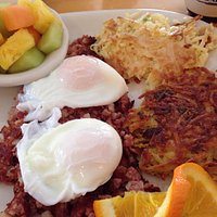 Delicious corned beef hash with farm fresh poached eggs done to perfection.