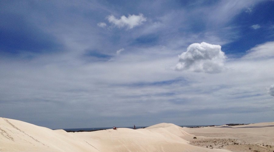 The open sky leaves sand surfers to their imagination of what they make on the clouds above.Espe