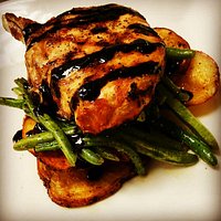 Grilled Beeler Farms Pork Chop with balsamic glaze