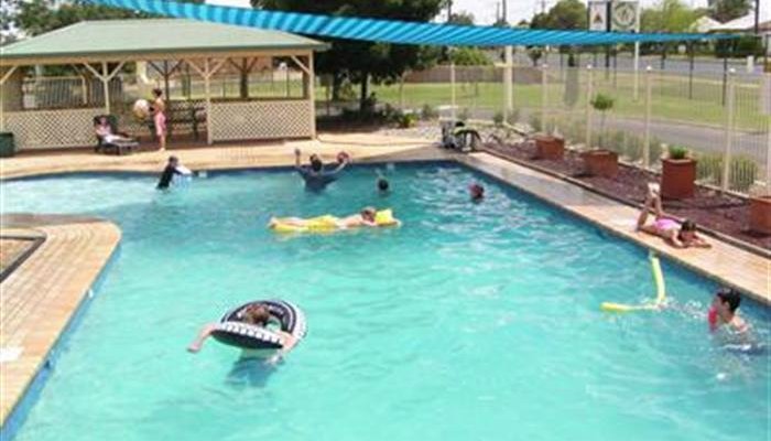 Shade covered, solar heated pool