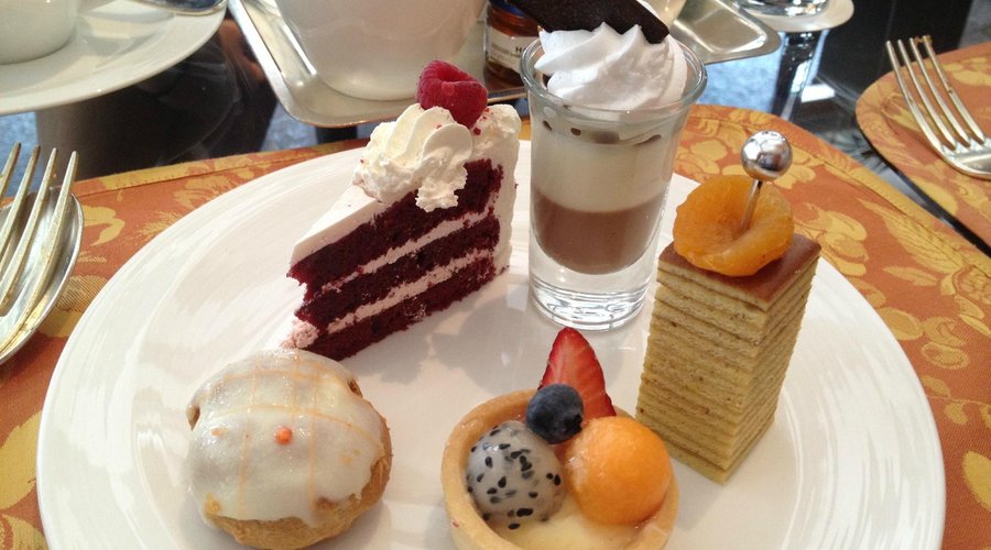 Clockwise from left: Orange Puff, Red Velvet cake, Panna Cotta, Kueh Lapis & Fruit Tart
