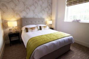 The Halston Hotel in Carlisle, image may contain: Lamp, Bed, Furniture, Home Decor