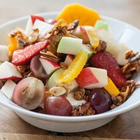 Home made granola with yogurt and fresh fruit