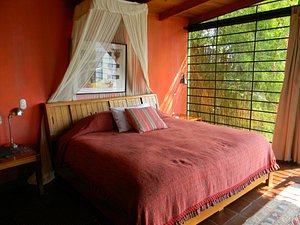 Villas B'alam Ya in Panajachel, image may contain: Bed, Furniture, Resort, Bedroom