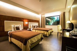 Ariana Hotel in Mindanao, image may contain: Furniture, Monitor, Screen, Bedroom