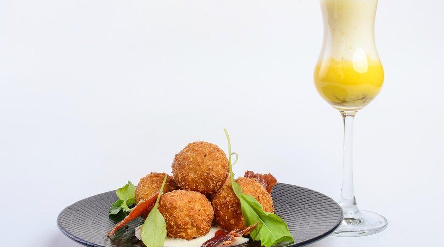 Crispy Quail eggs with manchego cheese cream and Spanish liquid omelette