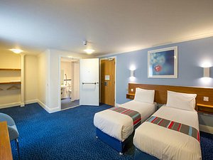 Travelodge Arundel Fontwell Park in Chichester, image may contain: Dorm Room, Furniture, Bedroom, Chair