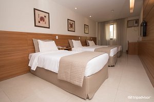 Hotel Granada in Rio de Janeiro, image may contain: Interior Design, Indoors, Bed, Furniture