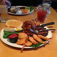 New York steak c/w shrimp and roast potatoes.