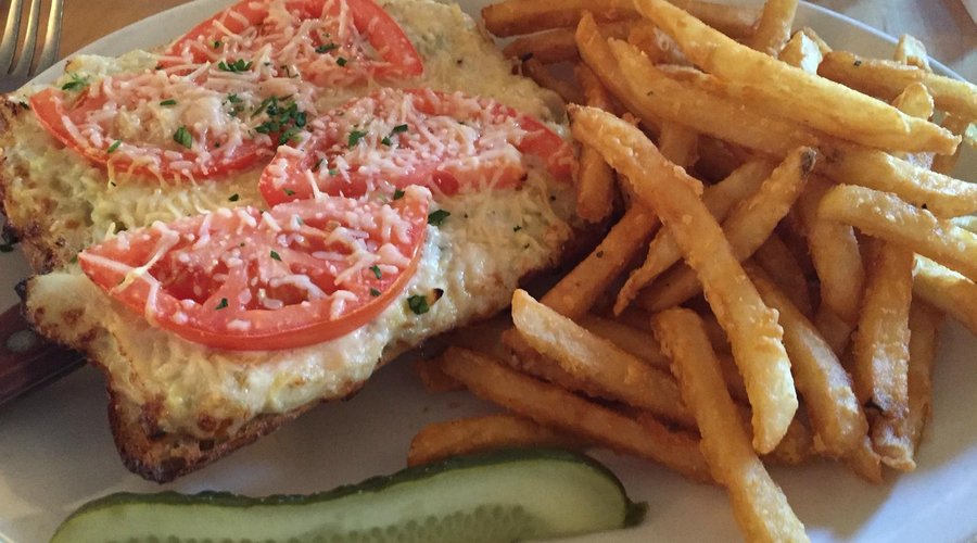 Crabmelt-Dungeness crab, artichoke, onion, tomato and parmesan open faced on a crispy ciabatta r