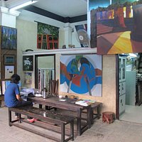 Pansodan Gallery main room. with paintings by Aung Htoo (plate), Win Tint (Shwedagon)