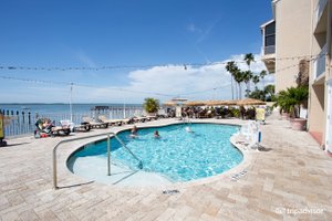 Beso Del Sol Resort in Dunedin, image may contain: Hotel, Resort, Pool, Waterfront