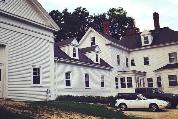 Side view of the house with the barn to the left.