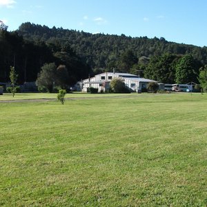 Main tenting flat with backpackers in rear