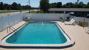 Carter's Motel and Mobile Village in Edgewater, image may contain: Pool, Water, Swimming Pool, Backyard