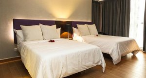 Exe Oriental Panamá in Panama City, image may contain: Furniture, Cushion, Hotel, Bed