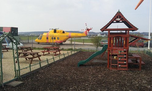 Children's play area and cafe outside seating.
