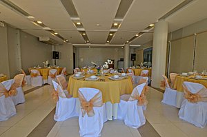 Empire Suites Hotel in Palawan Island, image may contain: Indoors, Reception Room, Dining Table, Chair