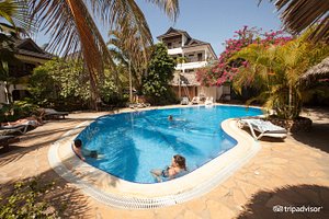Langi Langi Beach Bungalows in Zanzibar Island, image may contain: Villa, Resort, Hotel, Pool