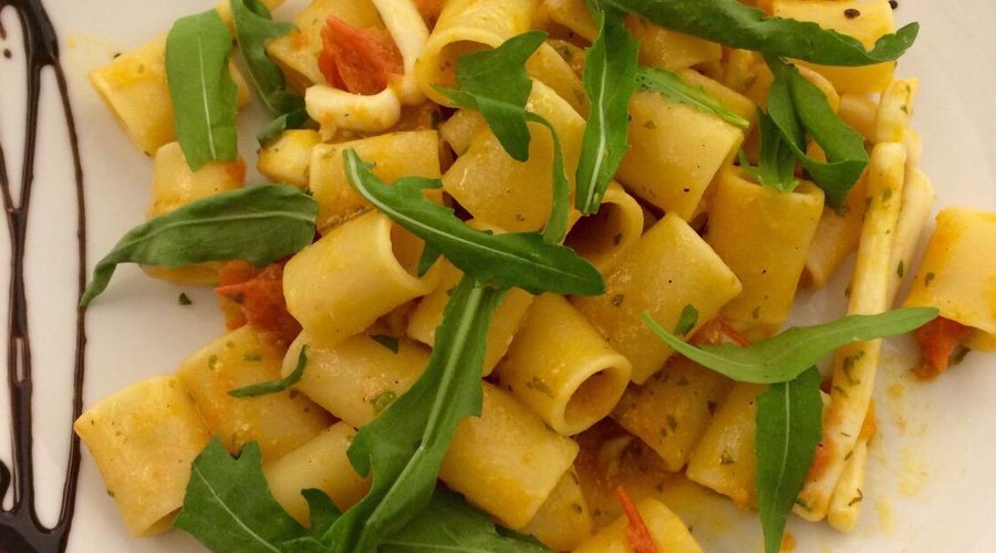 Tubettoni with squid cherry tomatoes and rocket