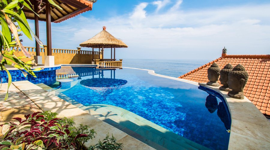 Jewel toned infinity pool with view of Bali Sea