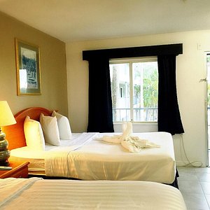 Lantern Inn & Suites in Sarasota, image may contain: Hotel, Resort, Pool, Chair