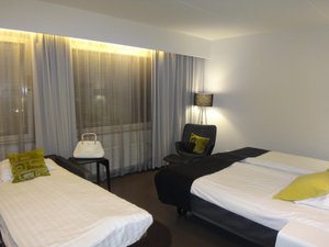 Greenstar Hotel Lahti in Lahti, image may contain: Bed, Lamp, Handbag, Chair