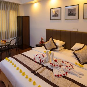 High Five Hotel in Yangon (Rangoon), image may contain: Home Decor, Hotel, Bed, Cushion