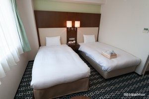 Hotel Il Cuore Namba in Osaka, image may contain: Furniture, Bed, Hotel, Bedroom