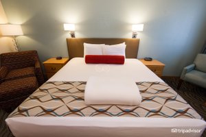 Old Town Inn in Florence, image may contain: Furniture, Bed, Lamp