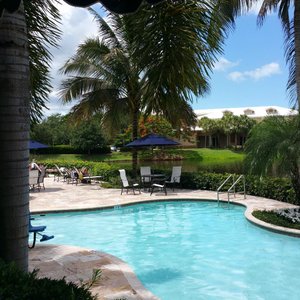 Inn at Pelican Bay in Naples, image may contain: Penthouse, Furniture, Interior Design, Bed