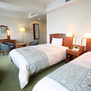 Hotel Boston Plaza Kusatsu Biwako in Kusatsu, image may contain: Bed, Furniture, Bedroom, Monitor