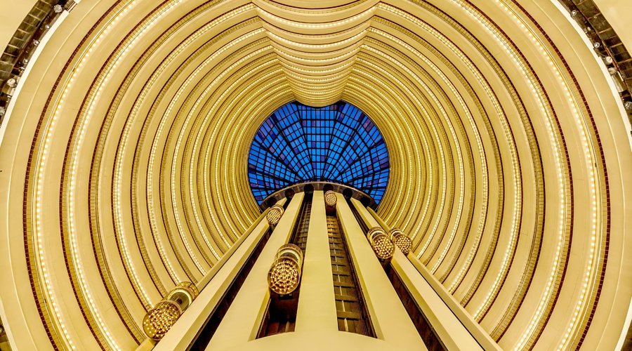 A stunning 27-storey glass atrium and distinctive bubble lifts