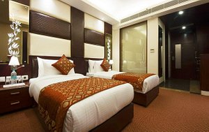 Hotel Golden Grand in New Delhi, image may contain: Hotel, Bed, Resort, Home Decor