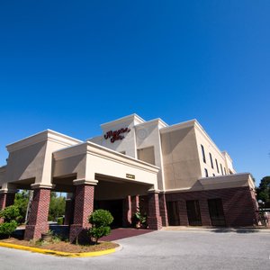 Hampton Inn Panama City Beach in Panama City Beach, image may contain: Hotel, Office Building, Neighborhood, Plant