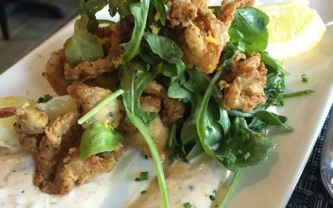Fried belly clams tossed with arugula, tartar sauce and lemons were zesty counterpart