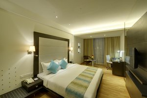 Meritas Picaddle Resort in Lonavala, image may contain: Chair, Bedroom, Bed, Lighting