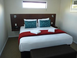 Astra Motor Lodge in Hamilton, image may contain: Furniture, Cushion, Bed, Bedroom