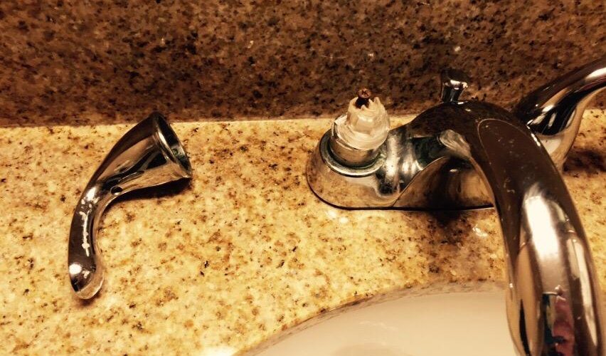 Large dresssing area; faulty hot water handle; daytime view of Philly Bar. & Grill;