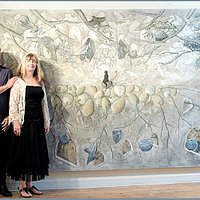 The artists in front of one of the large paintings.