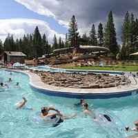 Lazy river runs through complex allowing visitor to float it like a real river.