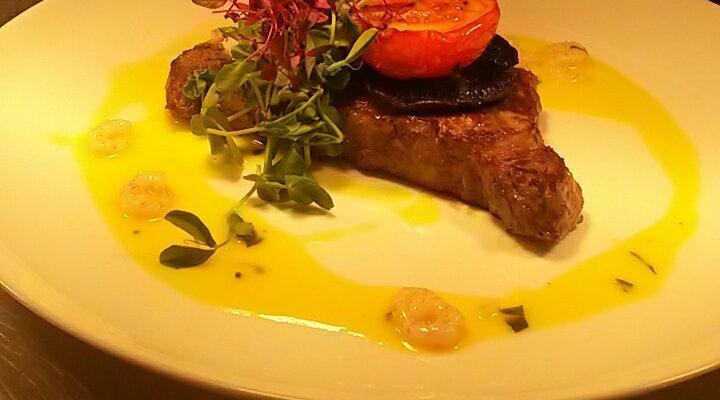 Surf and turf, red mullet with prawn and caper risotto and king prawns in a thai sauce