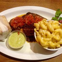 Blackened catfish with smoked jalapeño remoulade, mac-n-cheese and corn bread.