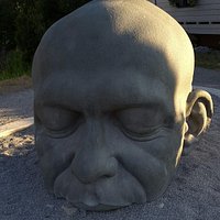 Big Head popping out from the sand