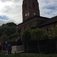 20th century church tower and Thomas More statue