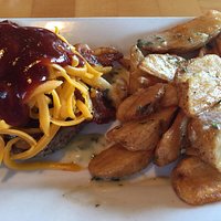 BBQ burger with bacon and cheddar cheese with no bun. A mound of tasty garlic fries.
